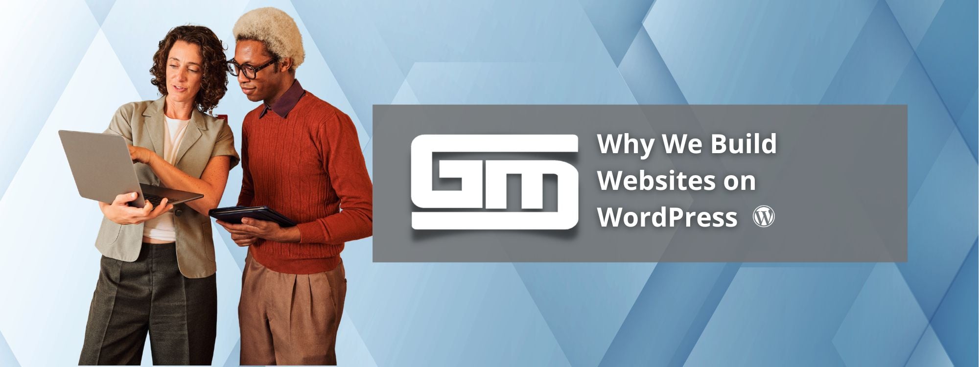 Two people discussing website design on a laptop, with text: "Why We Build Websites on WordPress."