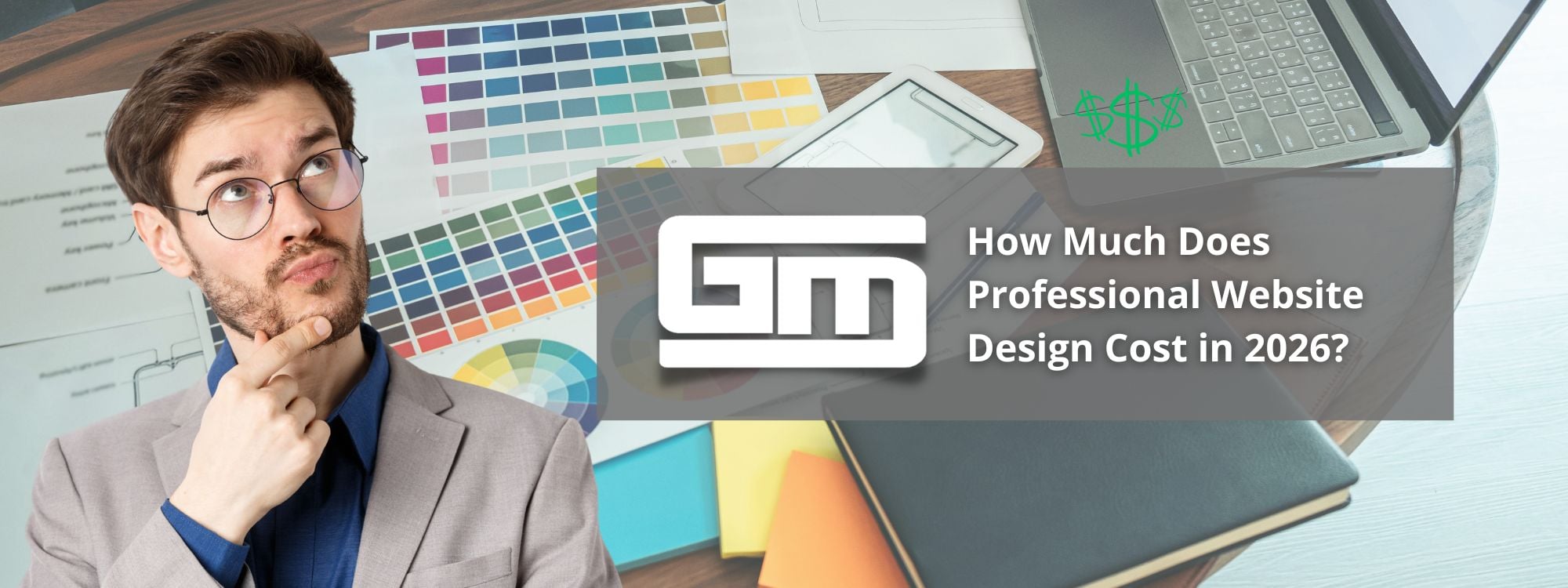 Man pondering website design costs in 2026, surrounded by color swatches and laptop.