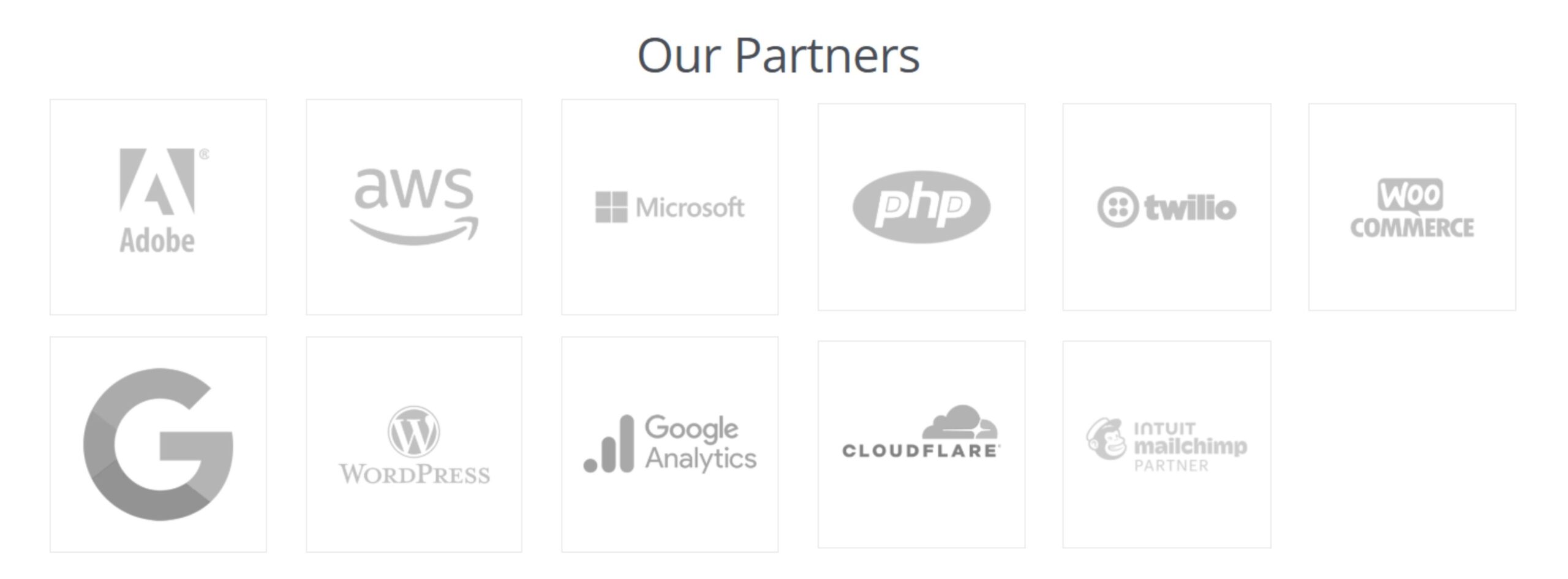 Logos of partners including Adobe, AWS, Microsoft, PHP, and WordPress. Relevant for website design.